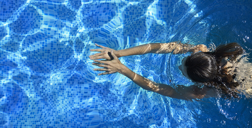 Woman Swimming In The Pool